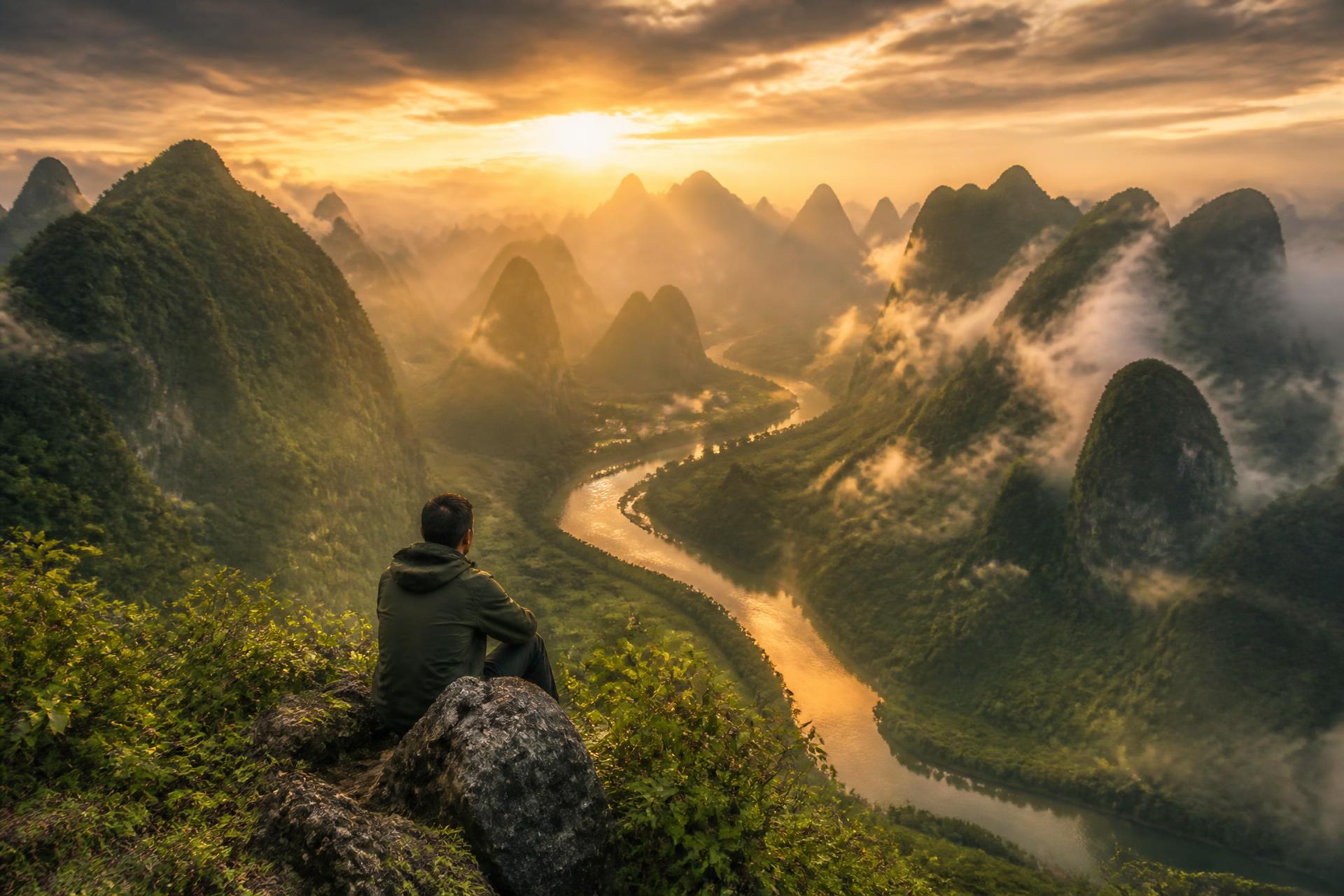 Misty green valley at golden hour